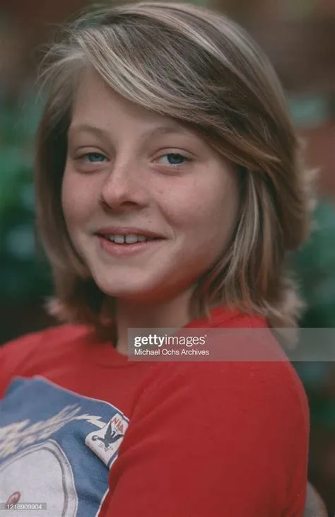 American child actress Jodie Foster, wearing a red t-shirt featuring ...