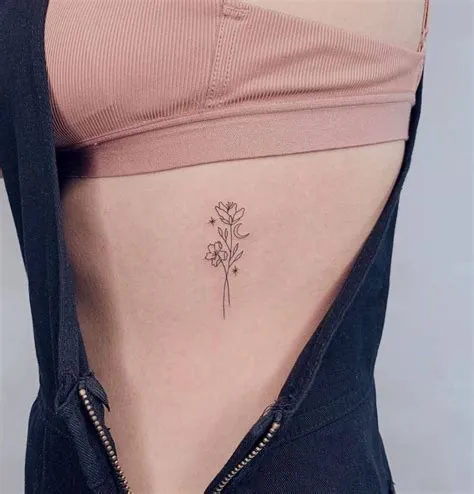 Fine line flower tattoo on rib | Flower tattoo on ribs, Rib tattoos for ...