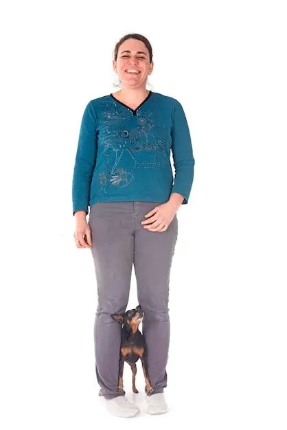 Premium Photo | Miniature pinscher and woman in studio