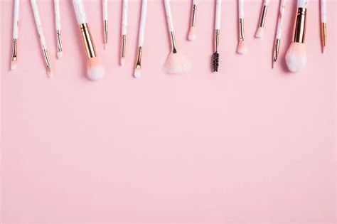 Frame of makeup brushes on pink background. Flat lay, top view. Make up ...