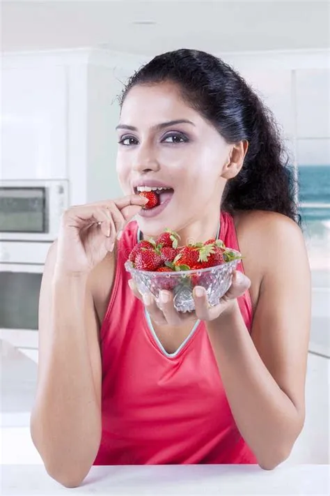 Woman with strawberry stock photo. Image of close, eating - 2026236