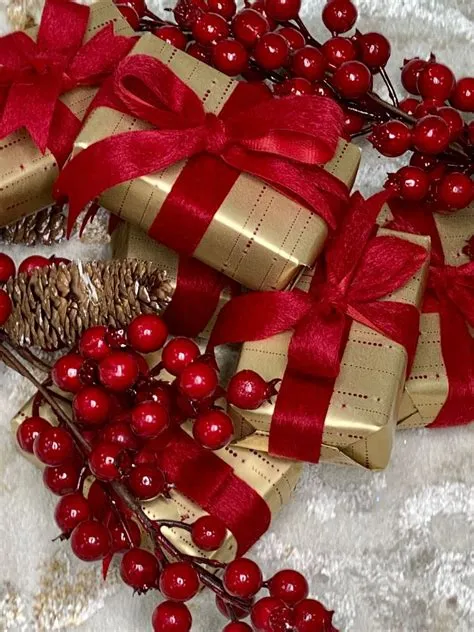 Christmas Presents Wrapped in Red and Gold with Festive Accents