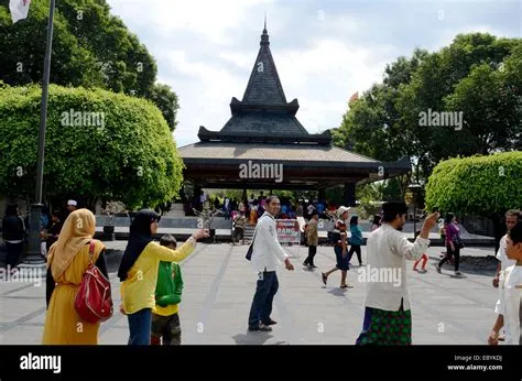 Blitar, Indonesia. August 13, 2013 -- Some visitors at the tomb of the ...