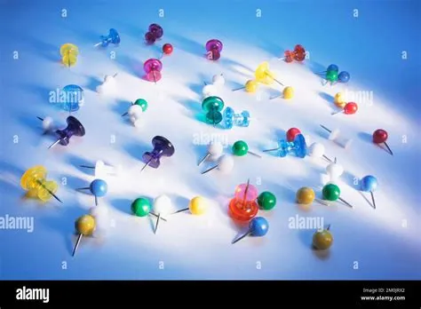 Drawing Pins on Blue Background Stock Photo - Alamy