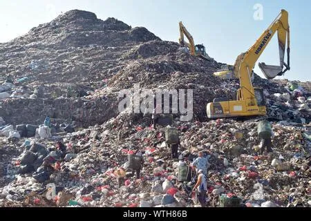 Scavengers sort and collect plastics for recycling at the garbage ...