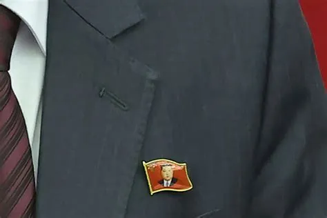 Face of North Korea's Kim Jong Un Appears on Official Pins - Newsweek