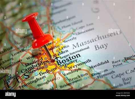 A push pin on a map of North America marking the location of the city ...