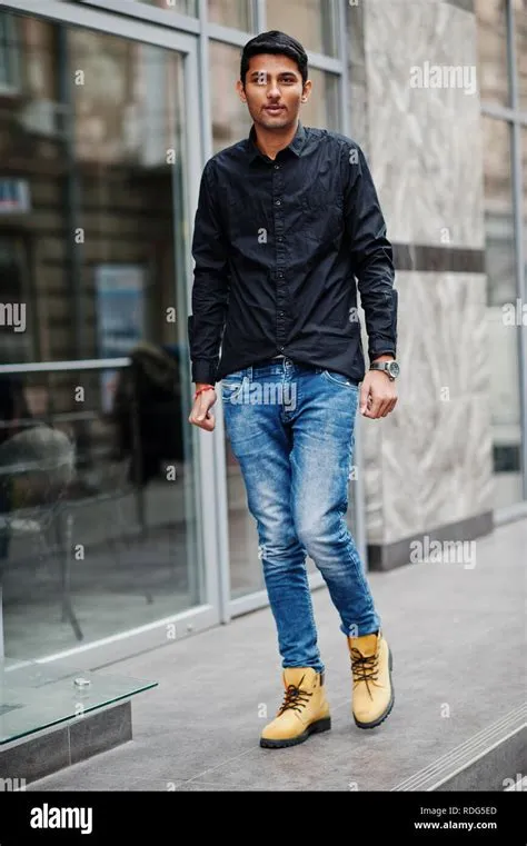 Stylish indian model man in casual clothes, black shirt posed outdoor ...