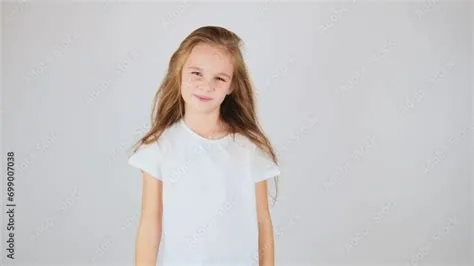 Beautiful preteen girl posing on camera isolated on white background ...