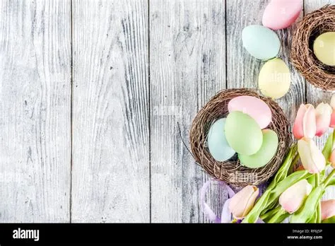 Pastel Easter background with tulip flowers and colorful painted Easter ...
