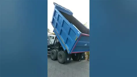 Tipper body with hydraulic tail door opening & automatic locking ...