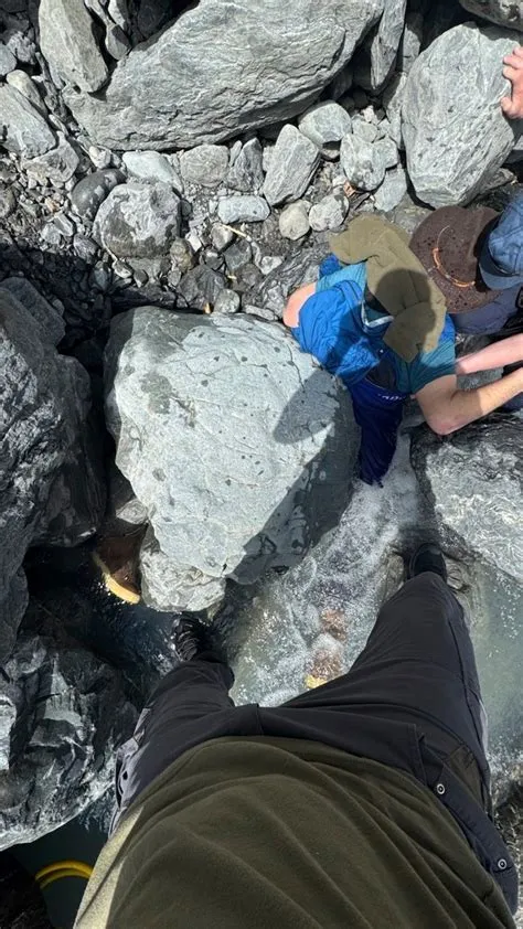 A 700-pound boulder pins Alaska man face-down in a glacier creek for ...