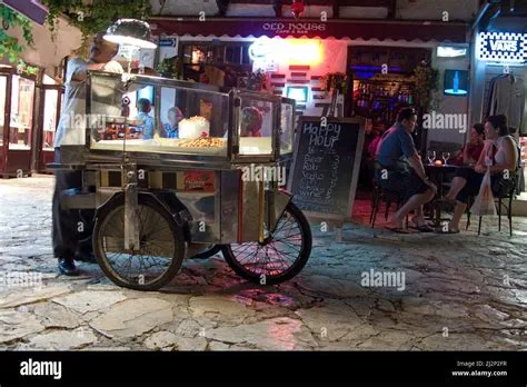 Almond seller at a restaurant, nightlife at old town of Kas, Lycia ...