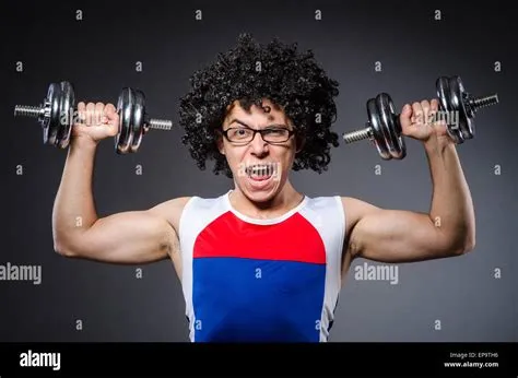 Funny man exercising with dumbbells Stock Photo - Alamy