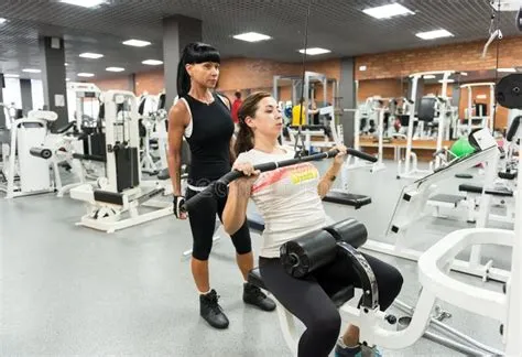 Young Woman with an Instructor in the Gym Editorial Image - Image of ...